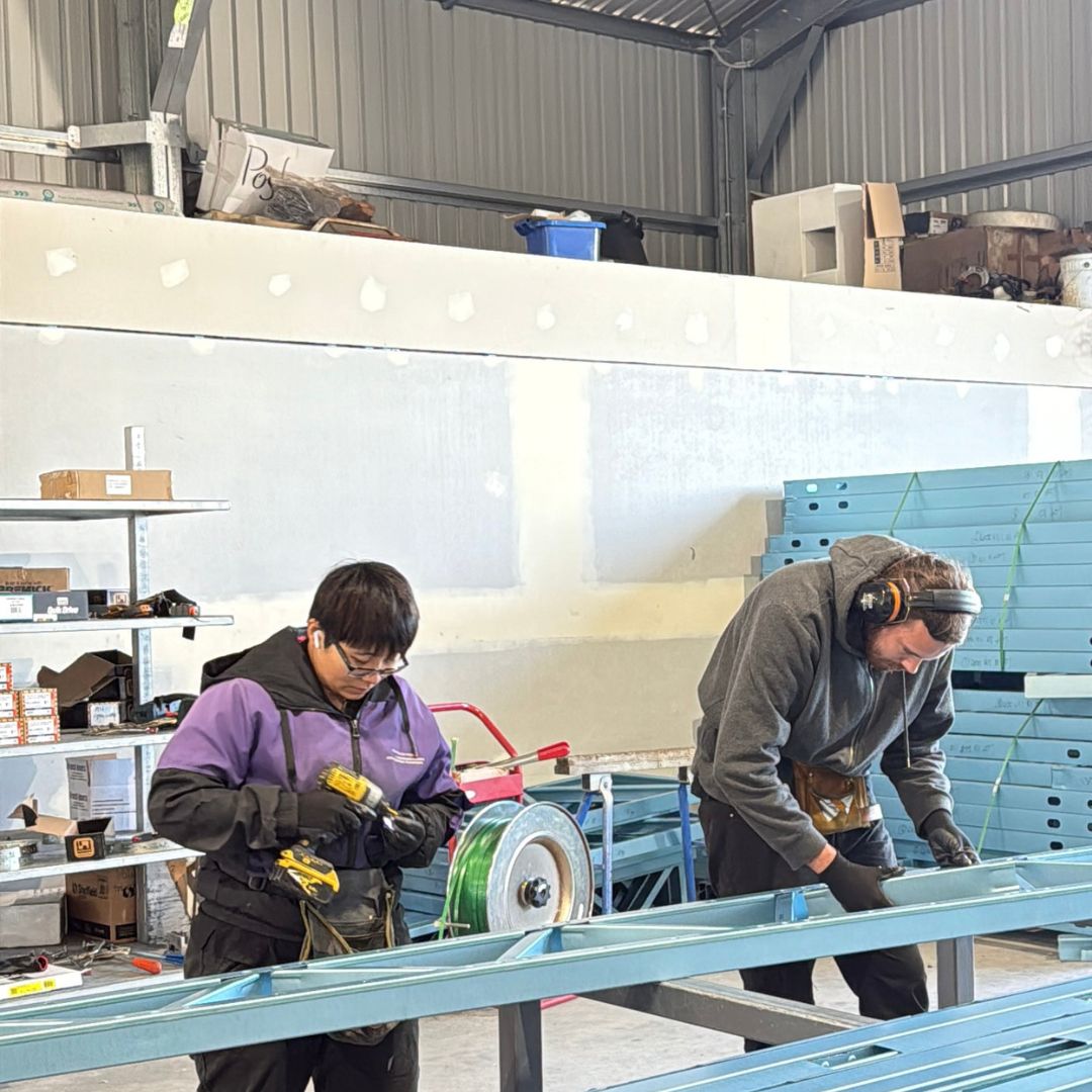 Guardian Steel team assembling a frame